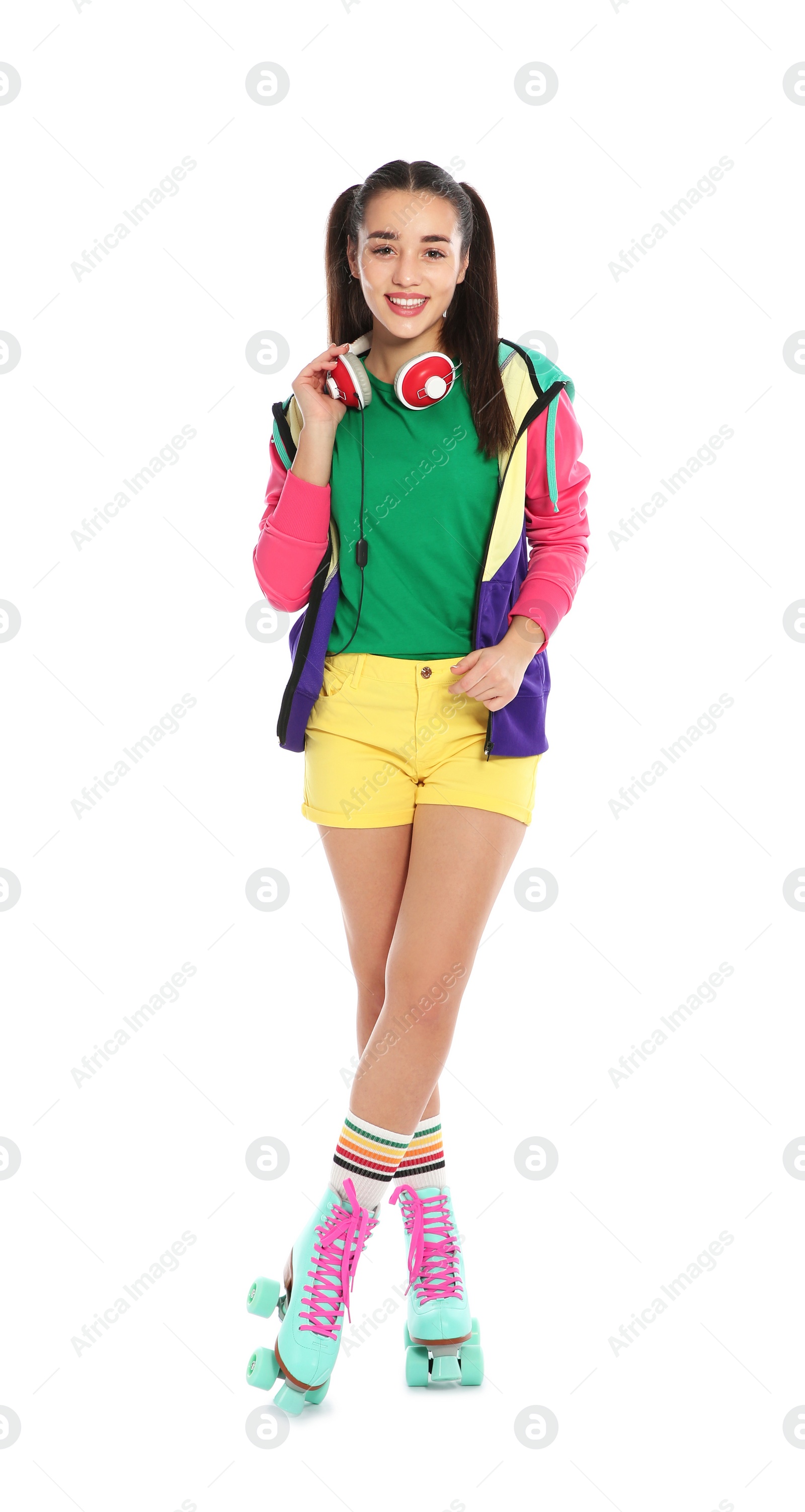 Photo of Full length portrait of young woman with roller skates on white background