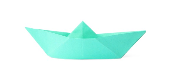 Turquoise paper boat isolated on white. Origami art
