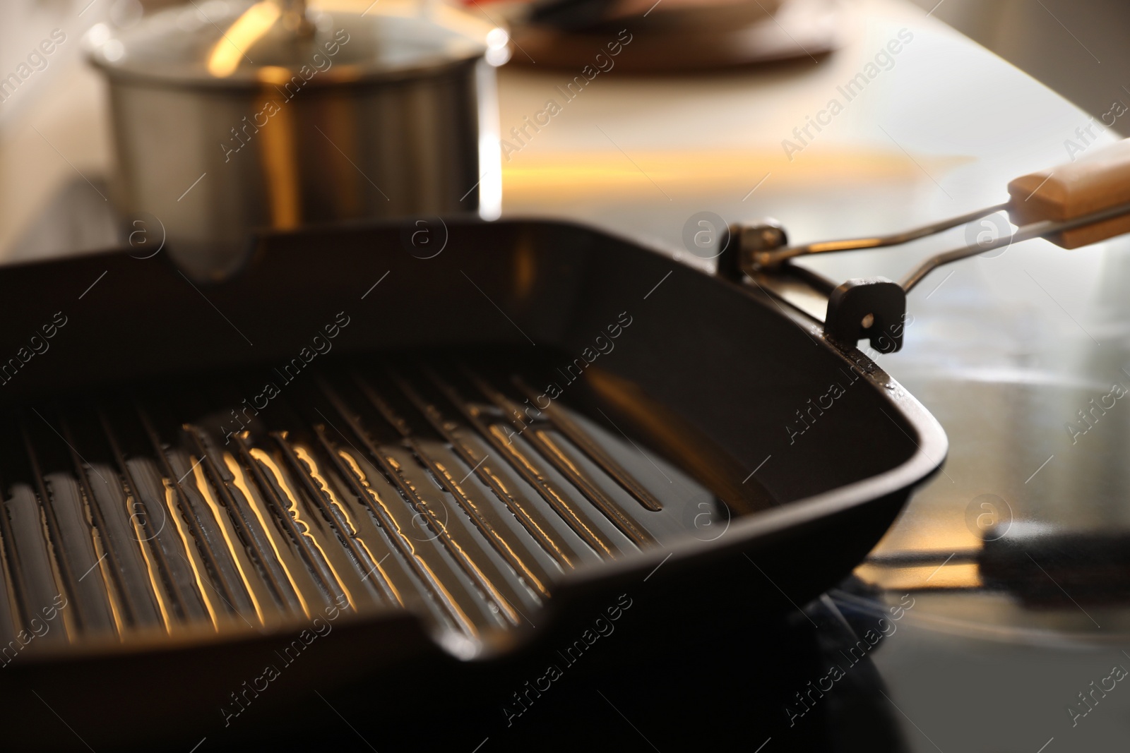 Photo of Frying pan with cooking oil on stove