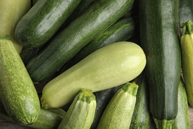 Top view of fresh ripe zucchini as background, closeup