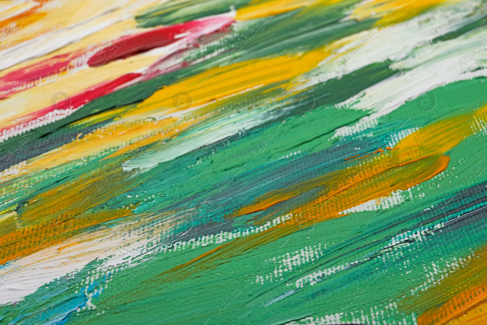 Photo of Beautiful strokes of colorful oil paints on white canvas as background, closeup