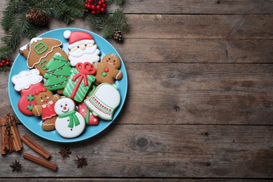 Delicious Christmas cookies on wooden table, flat lay. Space for text