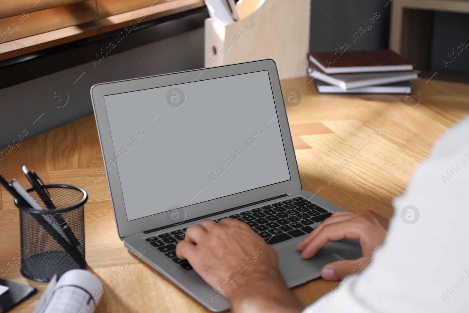 Photo of Coworkers working together online. Man using video chat on laptop, closeup