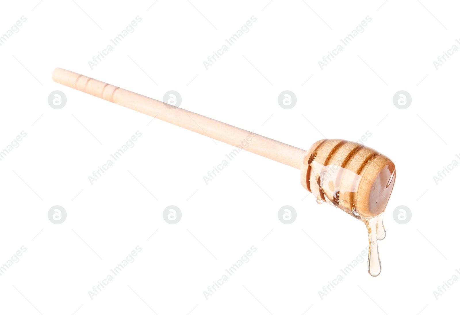 Photo of Natural honey dripping from dipper on white background