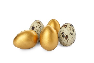 Photo of Golden eggs and quail ones on white background