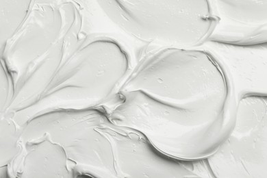 Photo of Texture of white oil paint as background, closeup