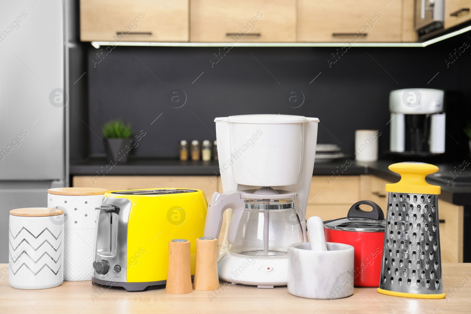 Photo of Set with modern domestic appliances in kitchen