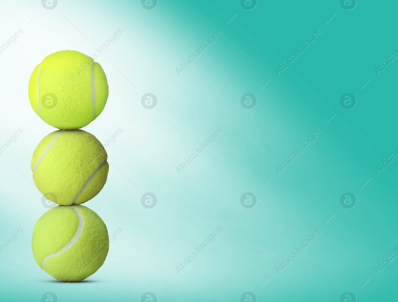 Image of Stack of tennis balls on turquoise background. Space for text