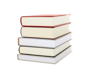 Many different books stacked on white background