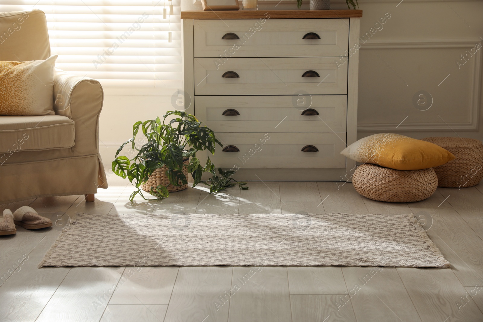 Photo of Modern room interior with stylish rug and furniture