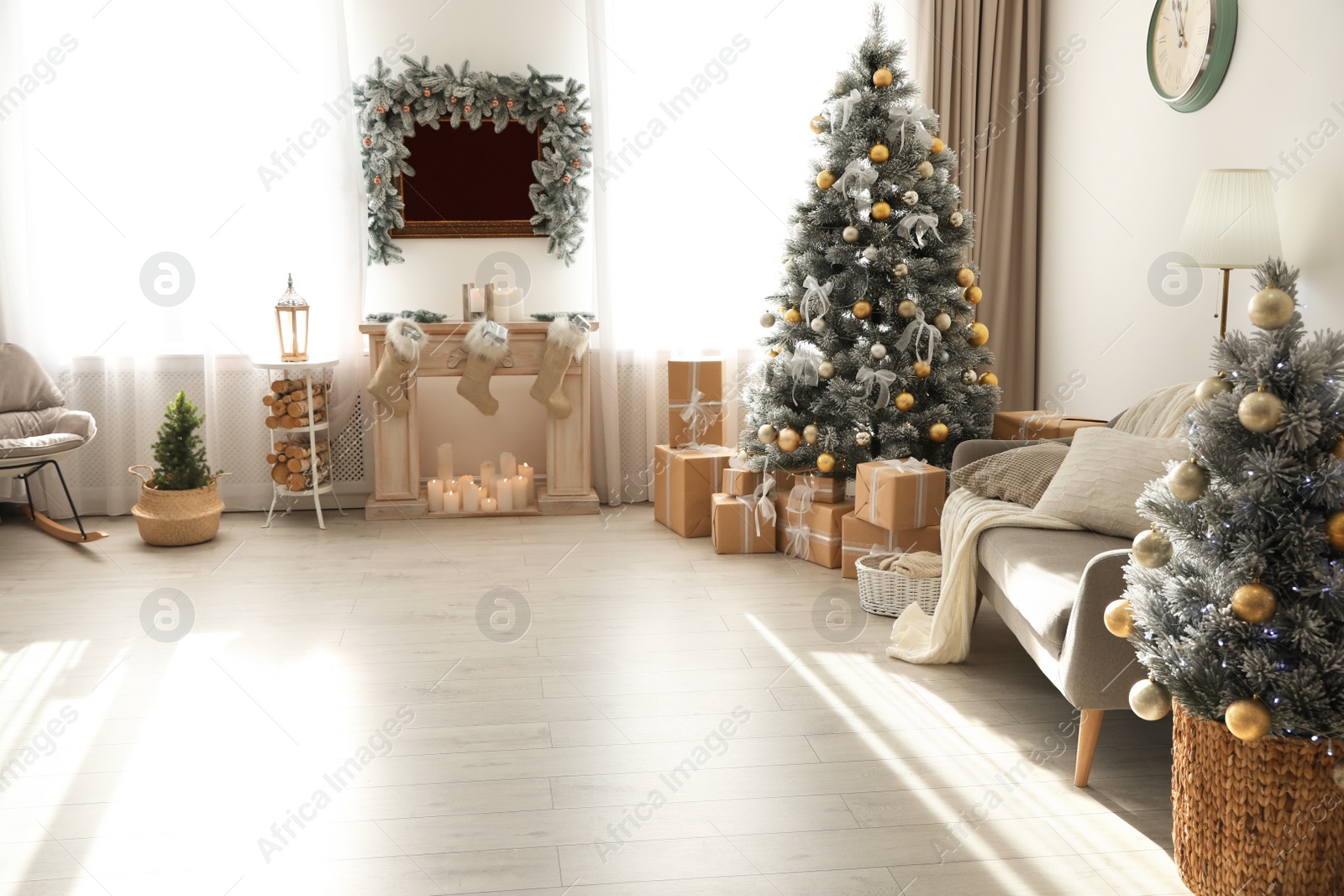 Photo of Stylish Christmas interior with beautiful decorated tree and fireplace