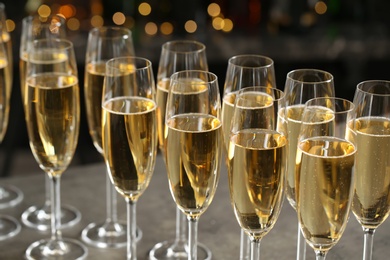 Glasses of champagne against blurred lights. Bokeh effect