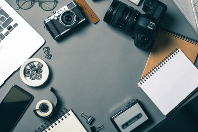 Flat lay composition with equipment for journalist on grey table, space for text