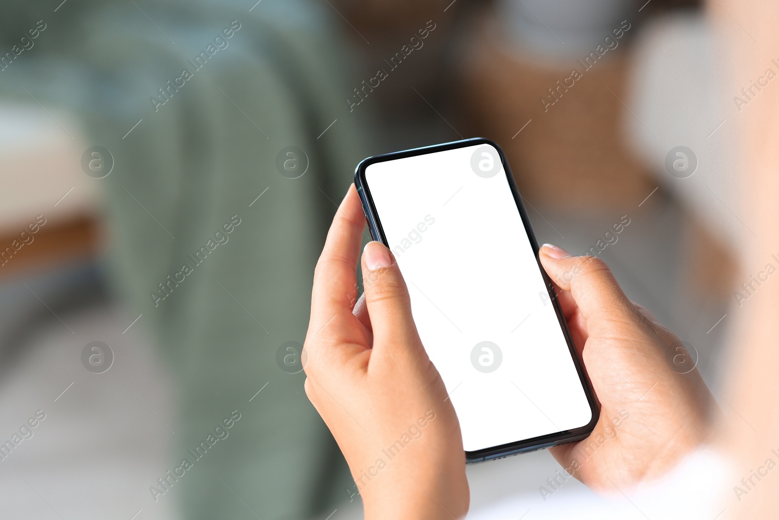 Photo of Closeup view of woman with smartphone indoors. Space for text