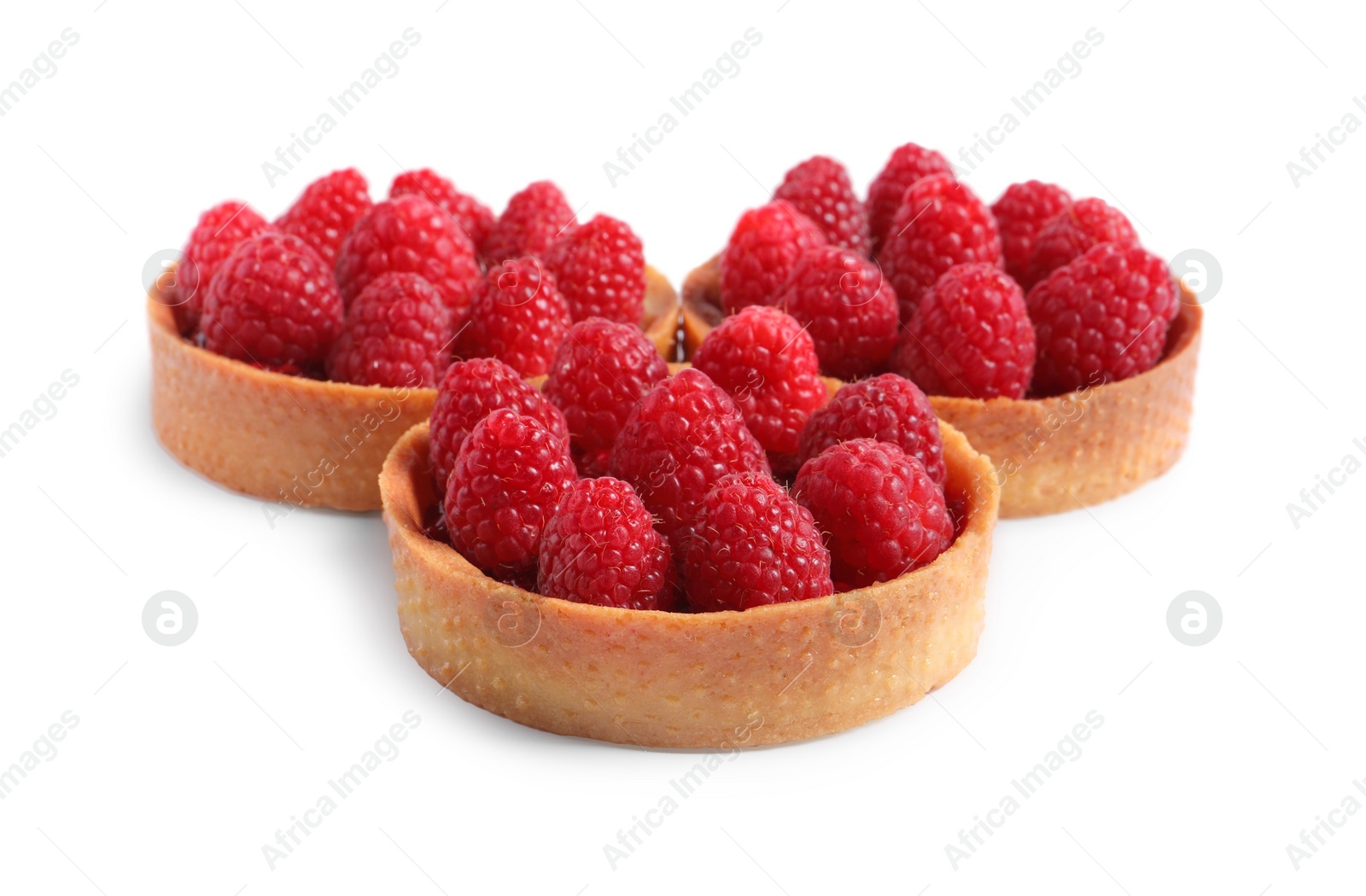 Photo of Tartlets with fresh raspberries isolated on white. Delicious dessert