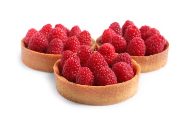 Photo of Tartlets with fresh raspberries isolated on white. Delicious dessert