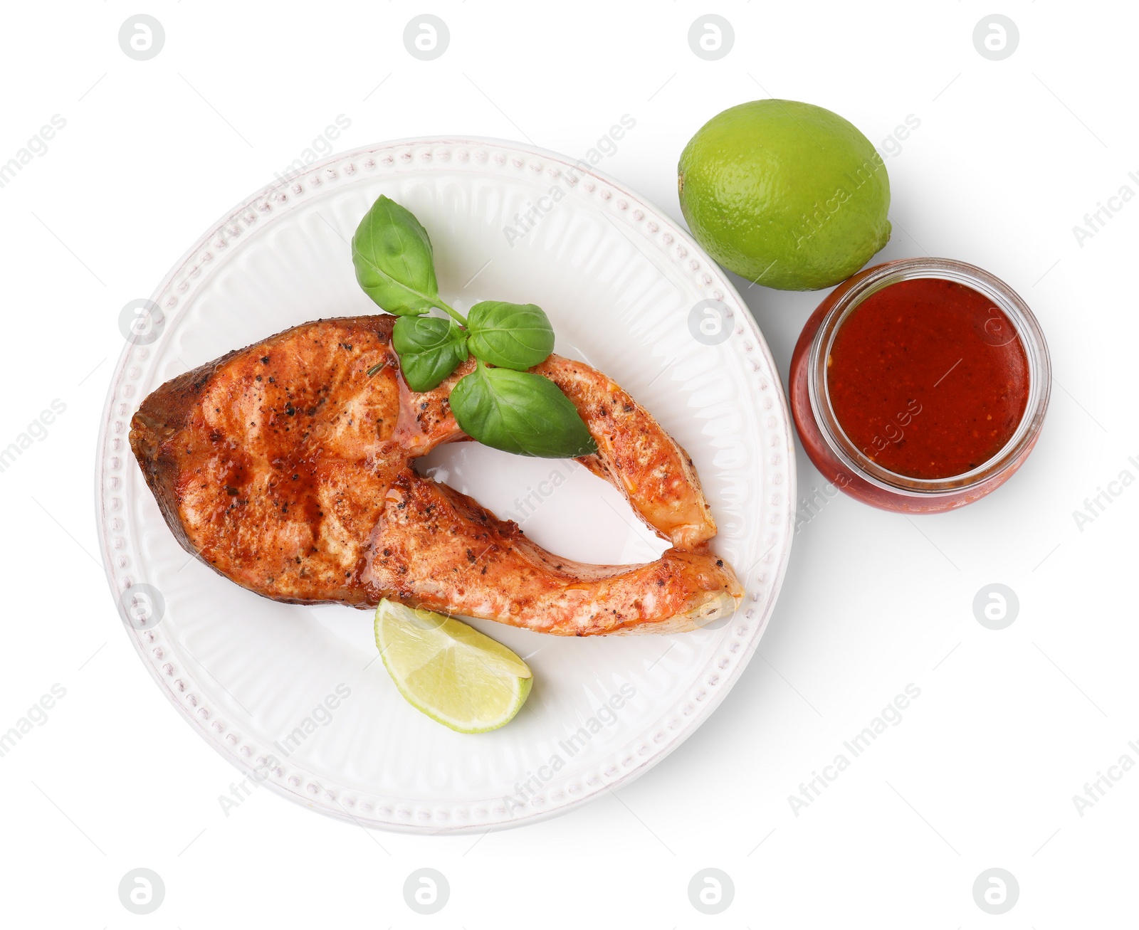 Photo of Fresh marinade, cooked fish, lime and basil isolated on white, top view