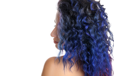 Young woman with bright dyed hair on white background, back view