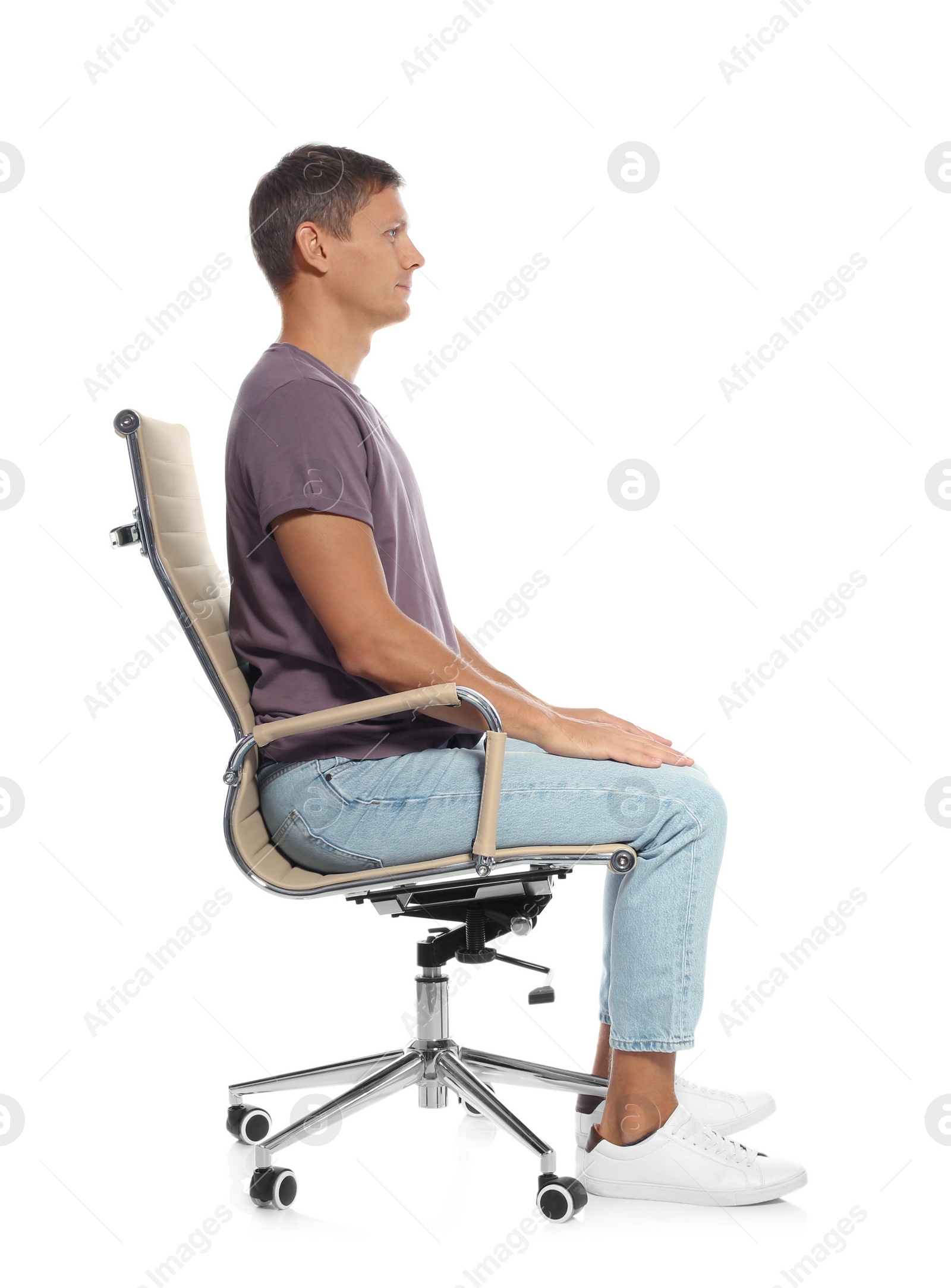 Photo of Man with good posture sitting in armchair against white background