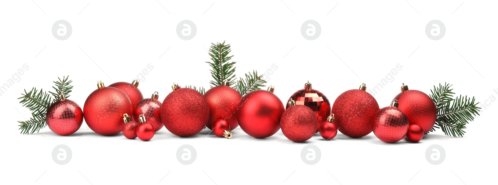 Photo of Red Christmas balls and fir twigs isolated on white