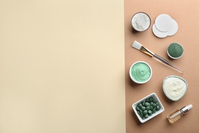 Photo of Flat lay composition with spirulina facial mask and ingredients on color background, space for text