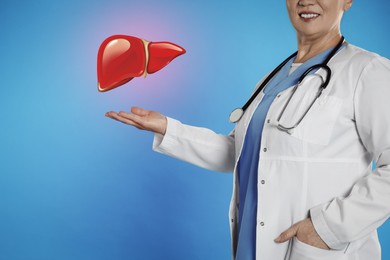 Mature doctor with stethoscope and illustration of healthy liver on light blue background, closeup