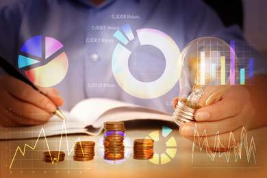 Image of Forex trading. Charts and woman with light bulb at table, closeup