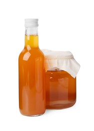 Photo of Delicious kombucha in glass bottle and jar isolated on white