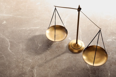 Photo of Scales of justice on table. Law concept