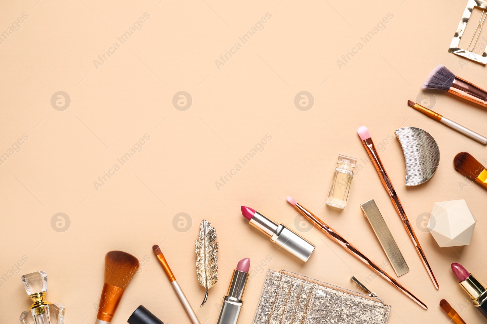 Photo of Makeup brushes and cosmetic products on beige background, flat lay. Space for text