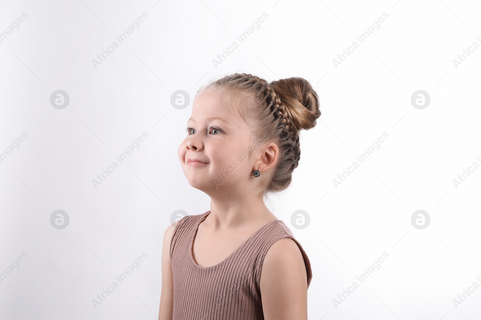 Photo of Little girl with braided hair on white background