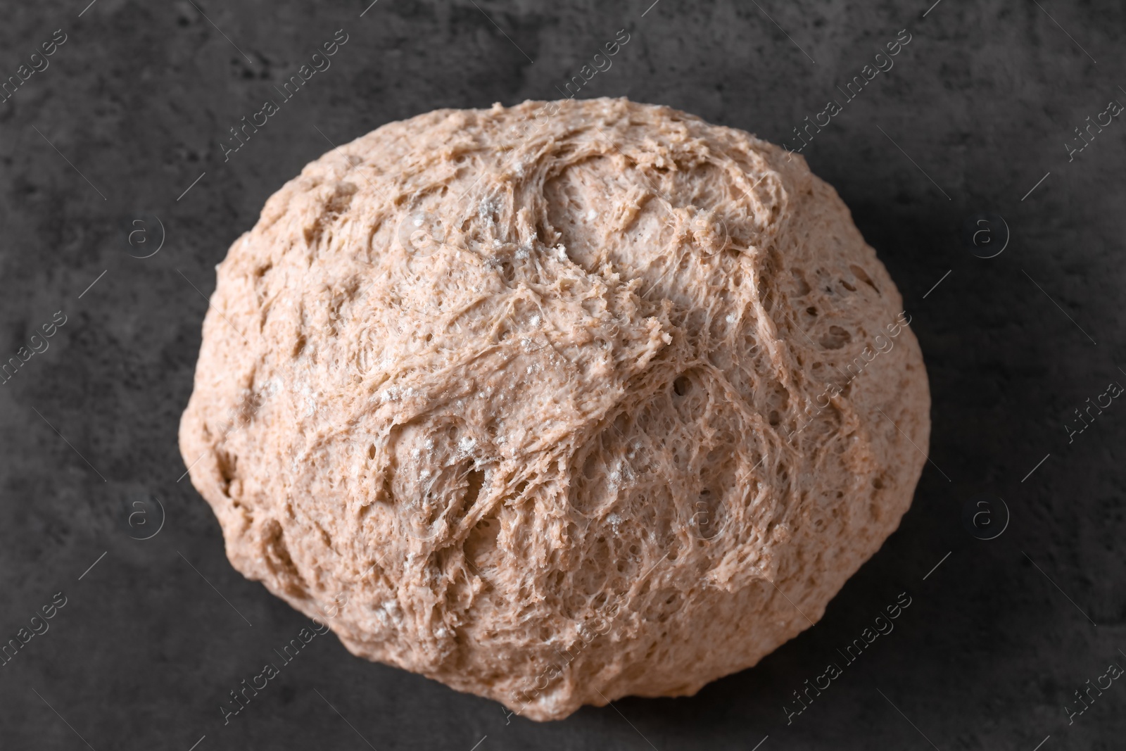 Photo of Fresh sourdough on grey table, top view