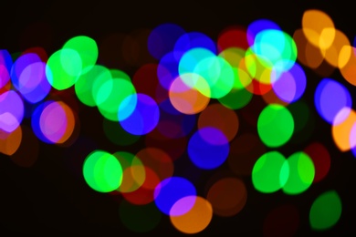 Beautiful colorful lights on dark background. Bokeh effect