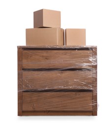 Photo of Chest of drawers wrapped in stretch film and boxes on white background