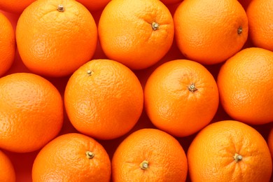 Fresh ripe oranges as background, top view