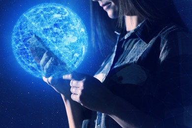 Image of Global network. Woman using smartphone on dark blue background, closeup. Digital image of Earth