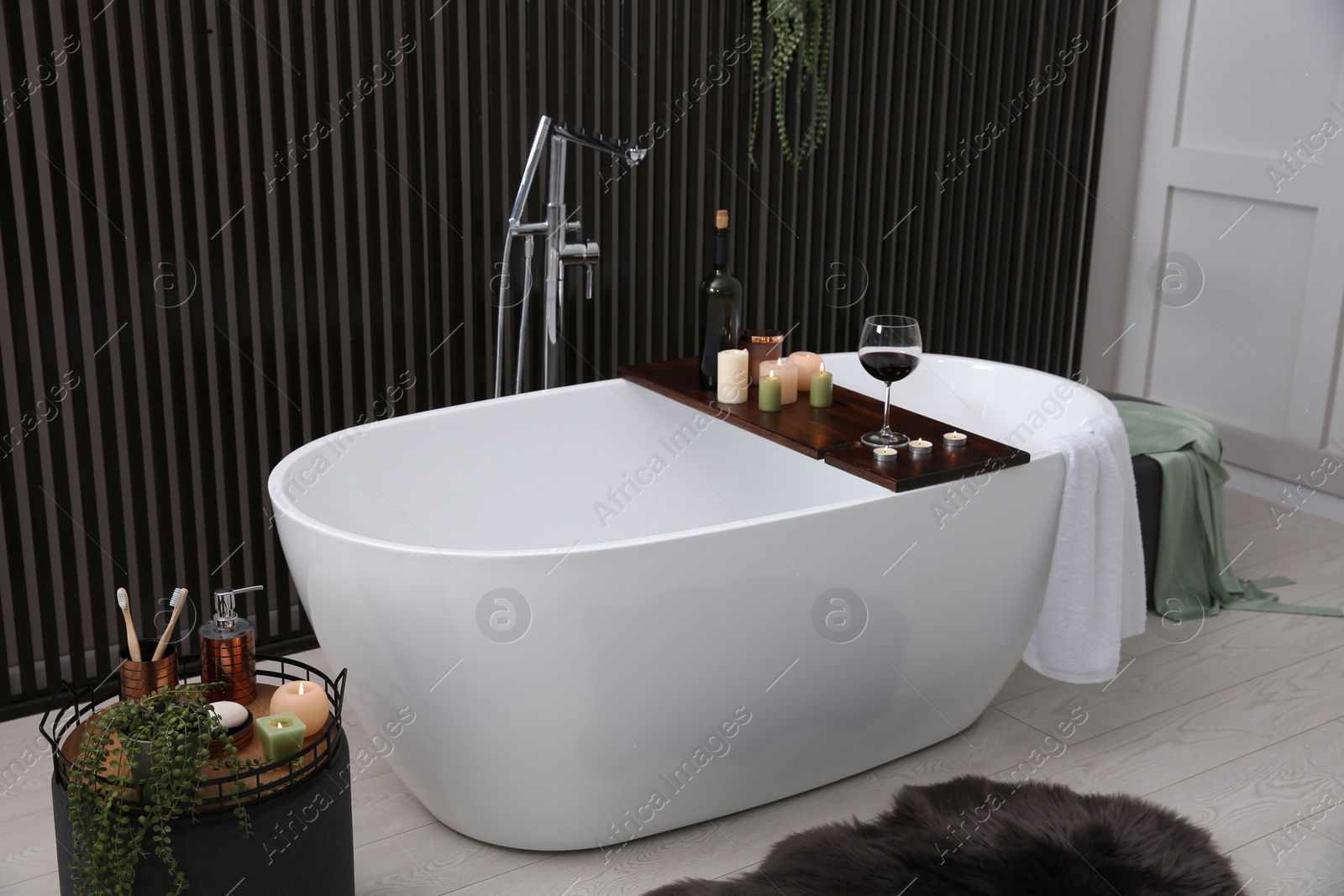 Photo of Stylish bathroom interior with modern white tub