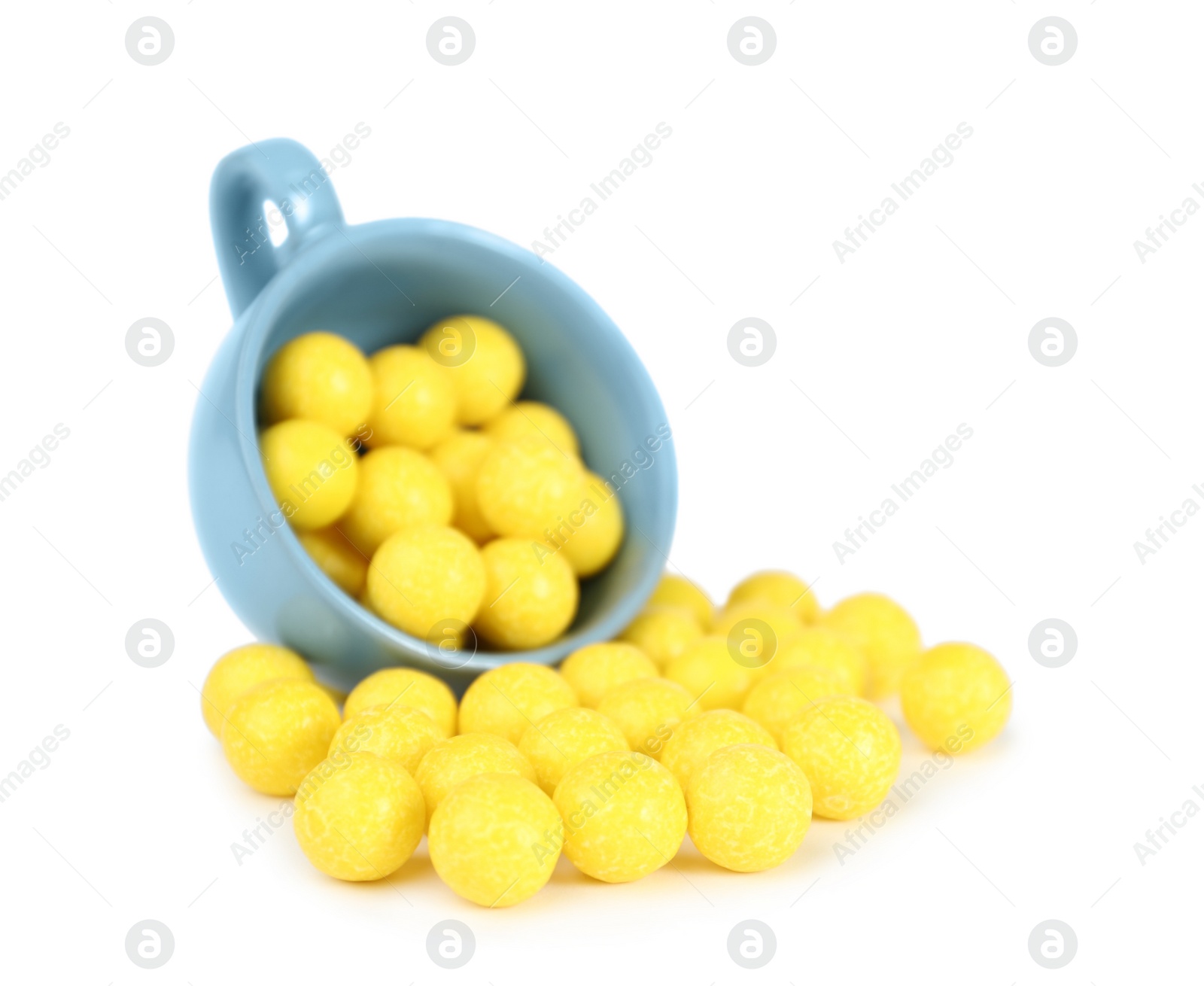 Photo of Tasty small lemon drops on white background