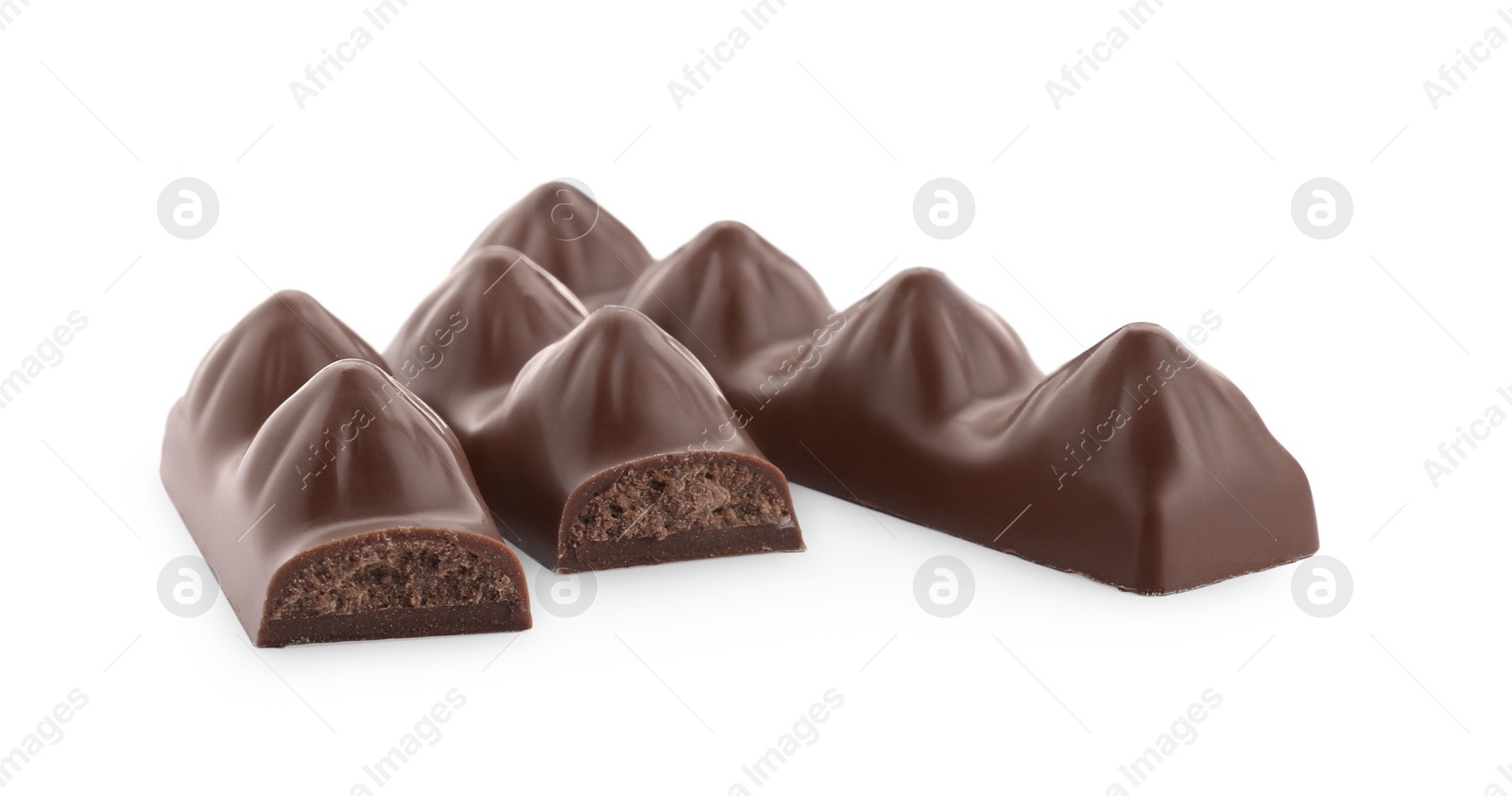 Photo of Pieces of tasty chocolate bars on white background