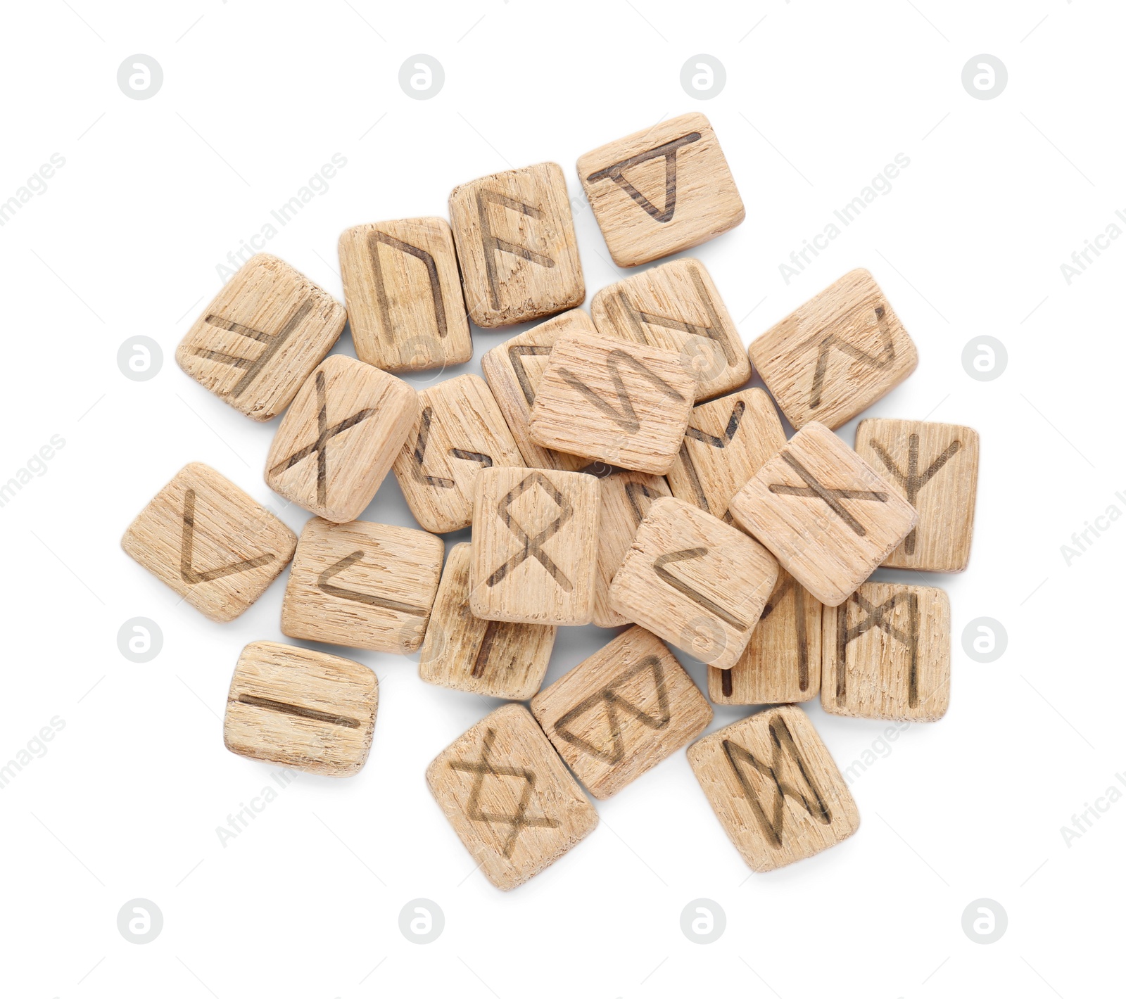 Photo of Pile of wooden runes isolated on white, top view