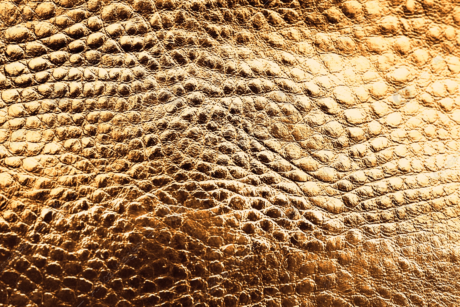 Image of Golden textured surface as background, closeup view