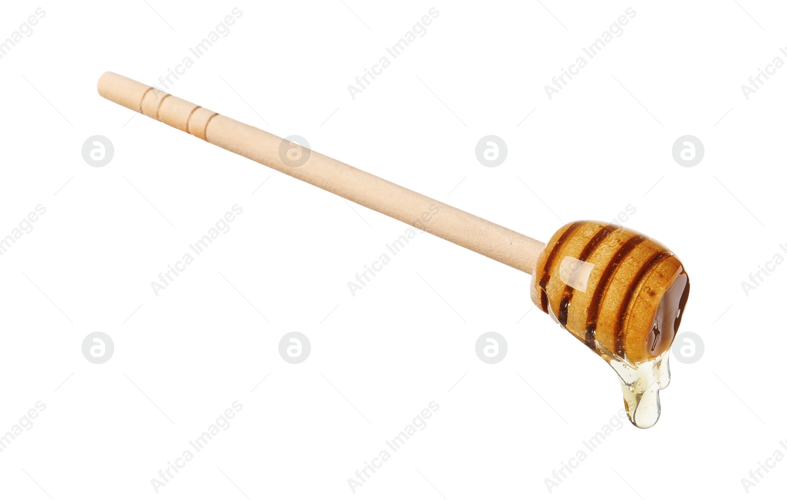 Photo of Natural honey dripping from dipper on white background