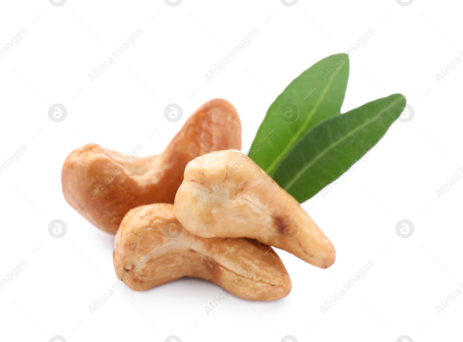 Photo of Tasty organic cashew nuts and green leaves isolated on white