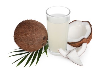 Photo of Glass of coconut water, leaf and nuts isolated on white