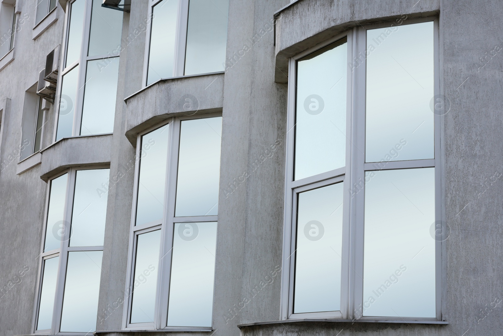 Photo of Modern office building with tinted windows. Urban architecture