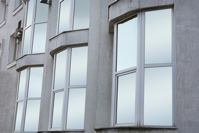 Modern office building with tinted windows. Urban architecture