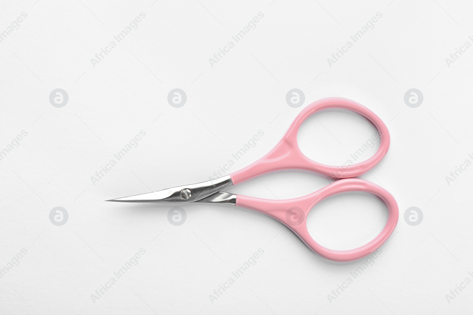 Photo of Pair of nail scissors on white background