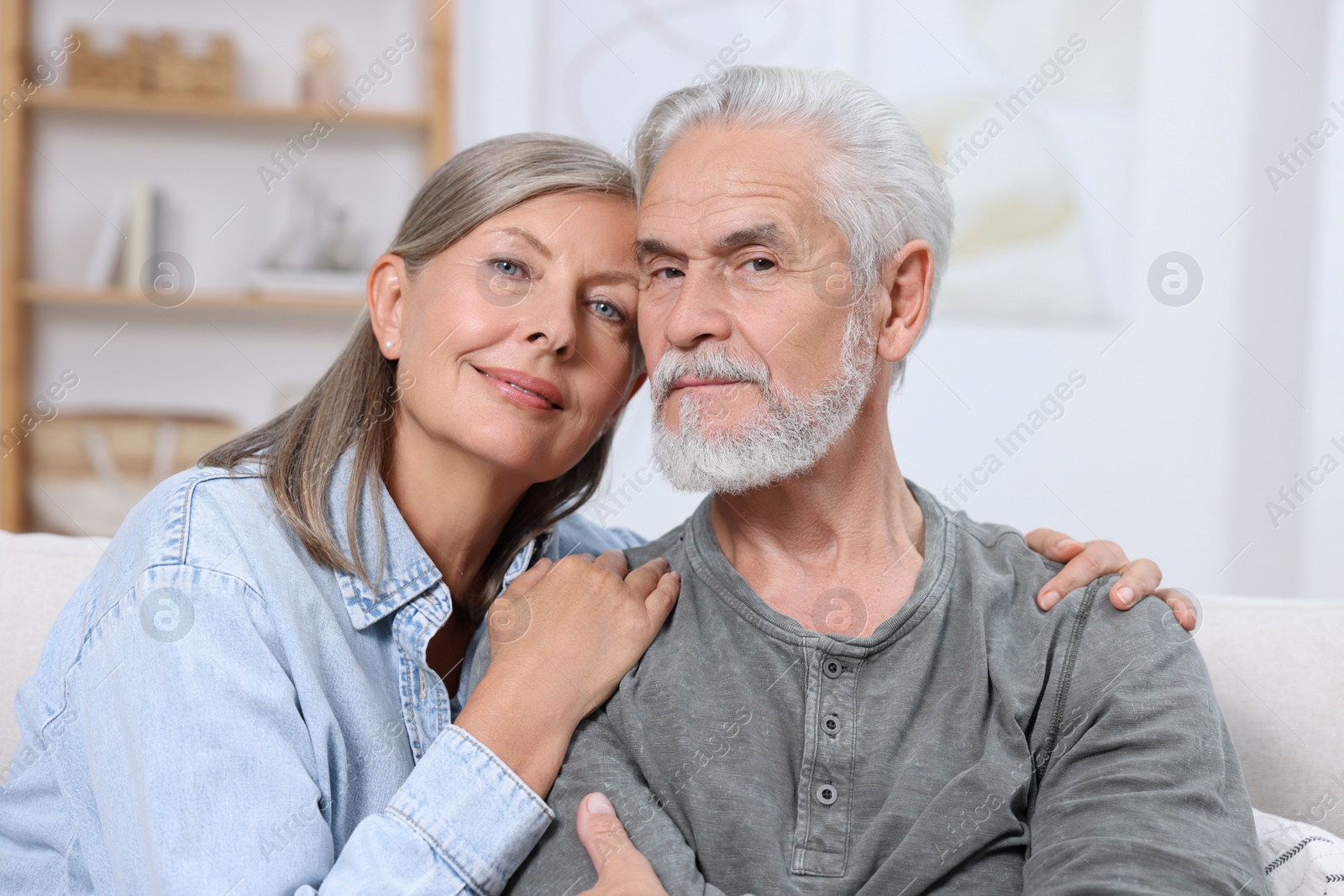 Photo of Portrait of affectionate senior couple at home