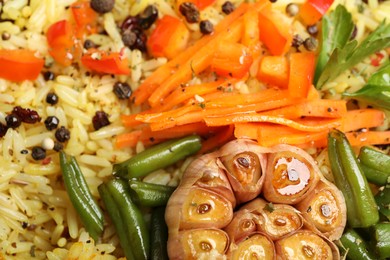 Photo of Tasty rice pilaf with vegetables as background, closeup