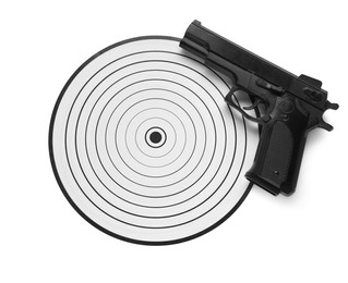 Photo of Shooting target and handgun isolated on white, top view